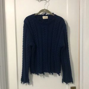 Cable knit sweater.